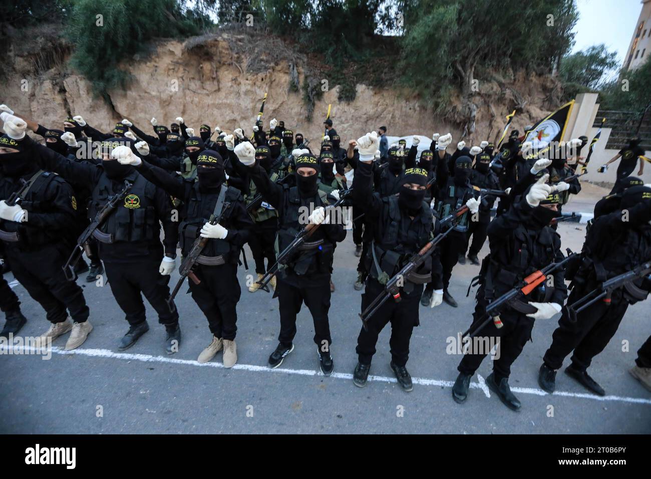 Members of the Al-Quds Brigades, the military wing of the Islamic Jihad movement, participate in an anti-Israel military parade on the occasion of the 36th anniversary of the founding of the movement in Gaza City. Stock Photo