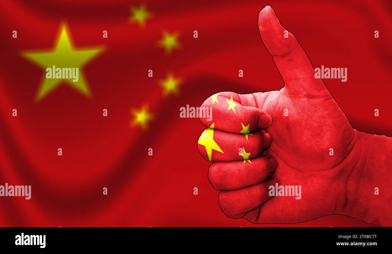 thumbs up in approval with the Chinese flag painted, Stock Photo