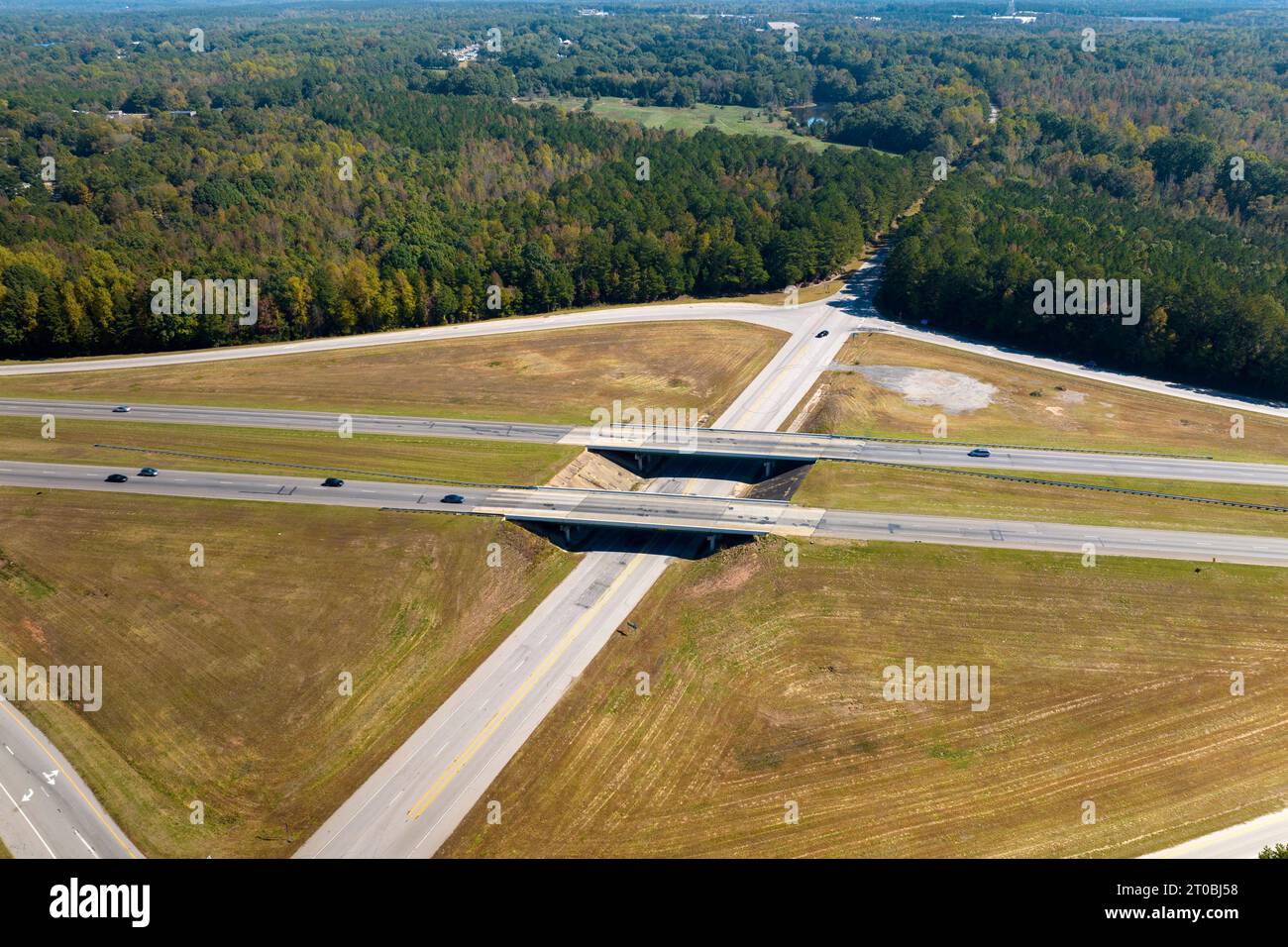 Aerial flyover over forest road hi-res stock photography and images - Alamy