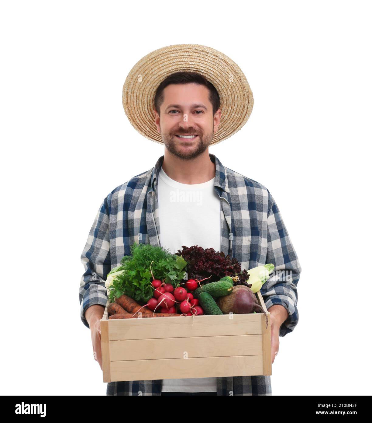 Harvesting season. Happy farmer holding wooden crate with vegetables on ...