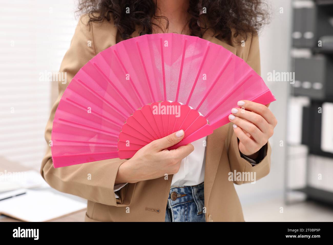Woman hot office fan hi-res stock photography and images - Alamy