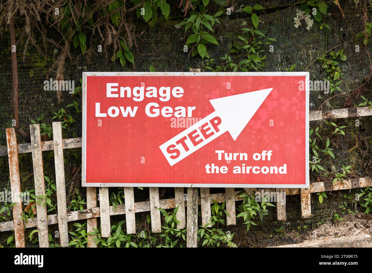 'Engage low gear, turn off the aircond' sign for the steep road Stock Photo