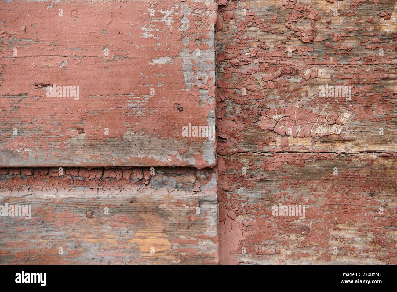 In Lithuania, the rustic charm of a weathered wooden textured wall adorns a traditional house, showcasing the rich cultural heritage and craftsmanship Stock Photo