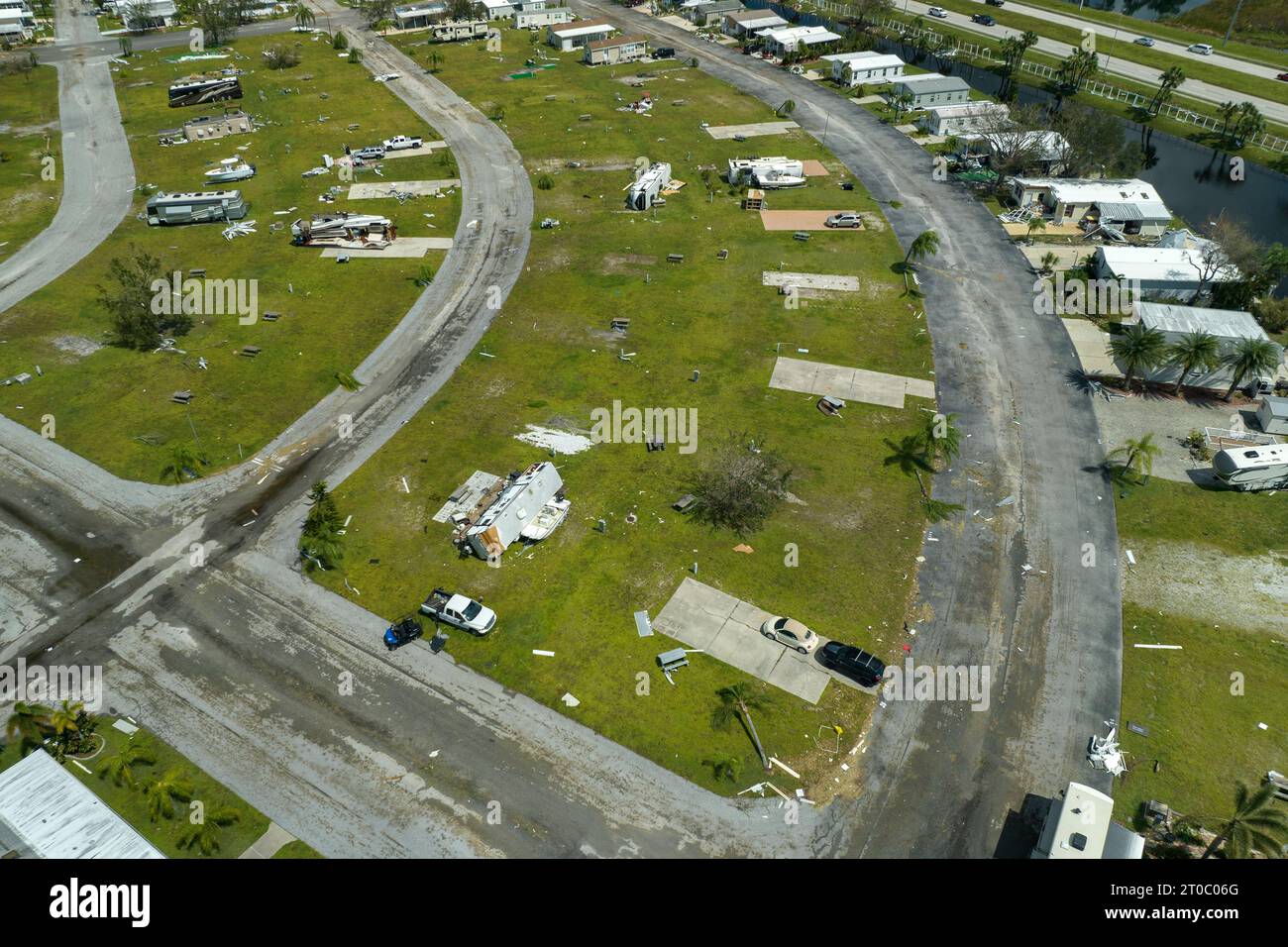 Severely damaged and overturned recreational vehicle camper vans and