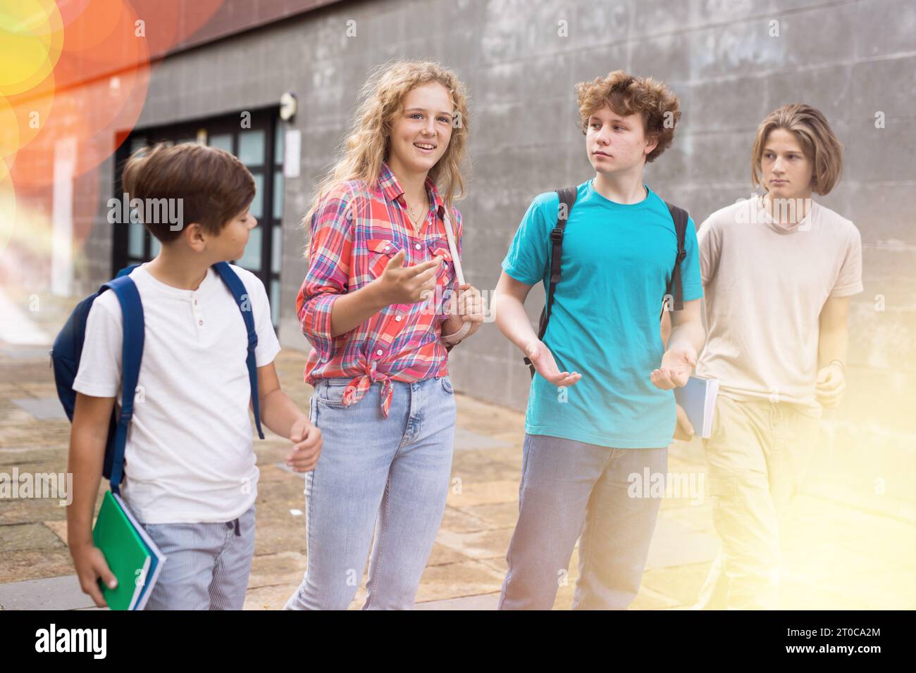 School friends walk after class Stock Photo - Alamy
