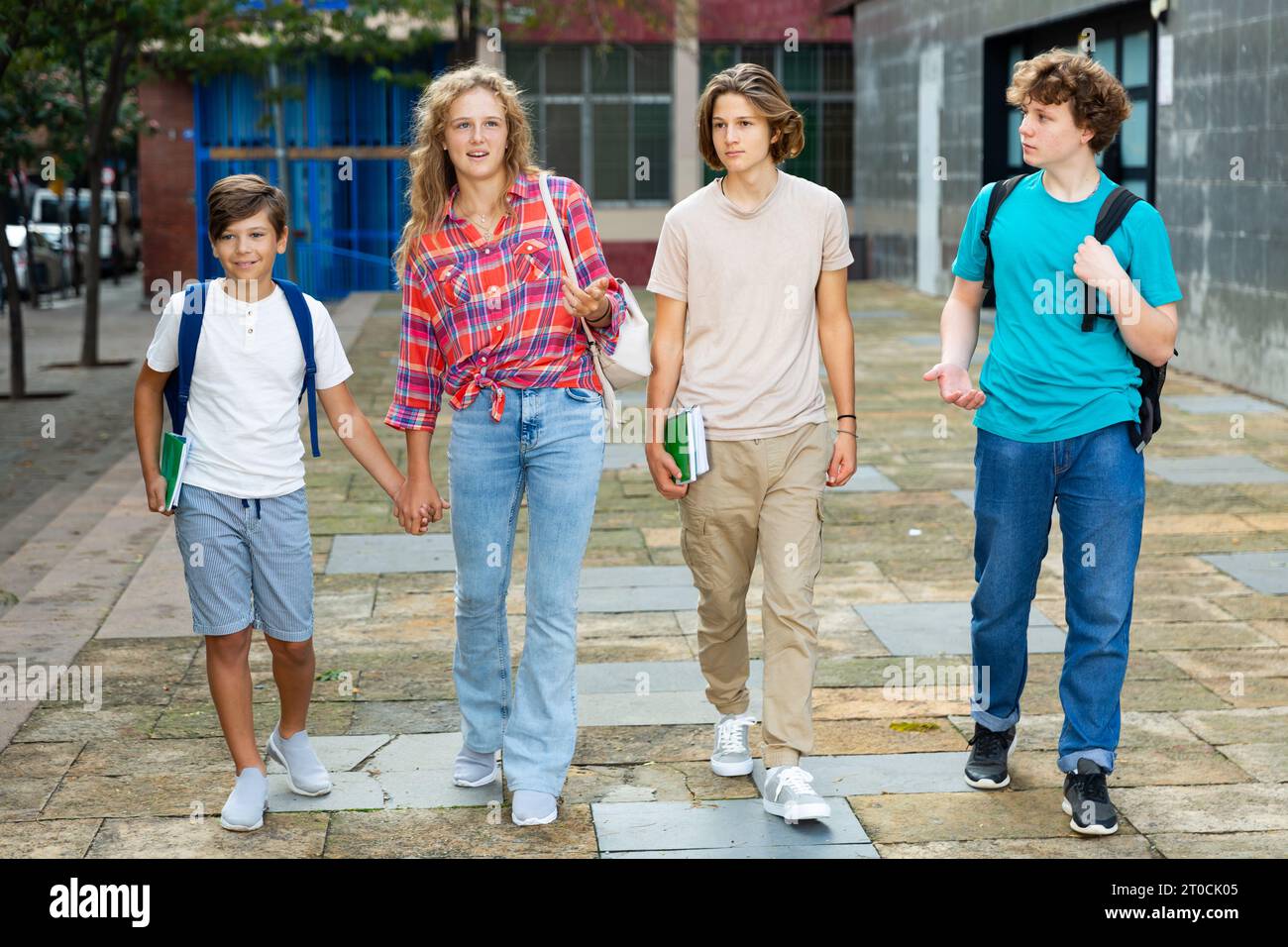 School friends walk after class Stock Photo - Alamy