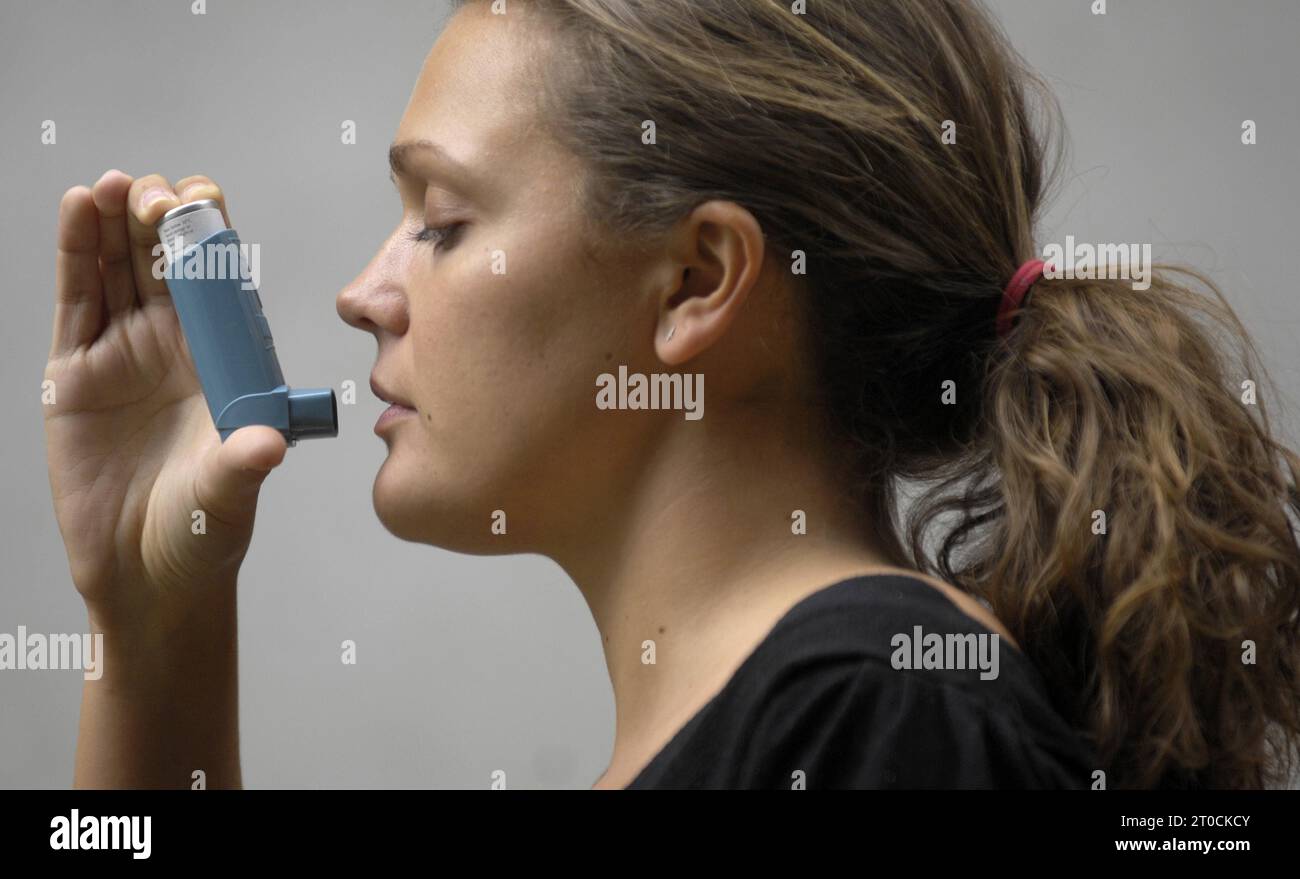 PA file photo of a woman using an asthma inhaler. See PA Feature IRISH ...