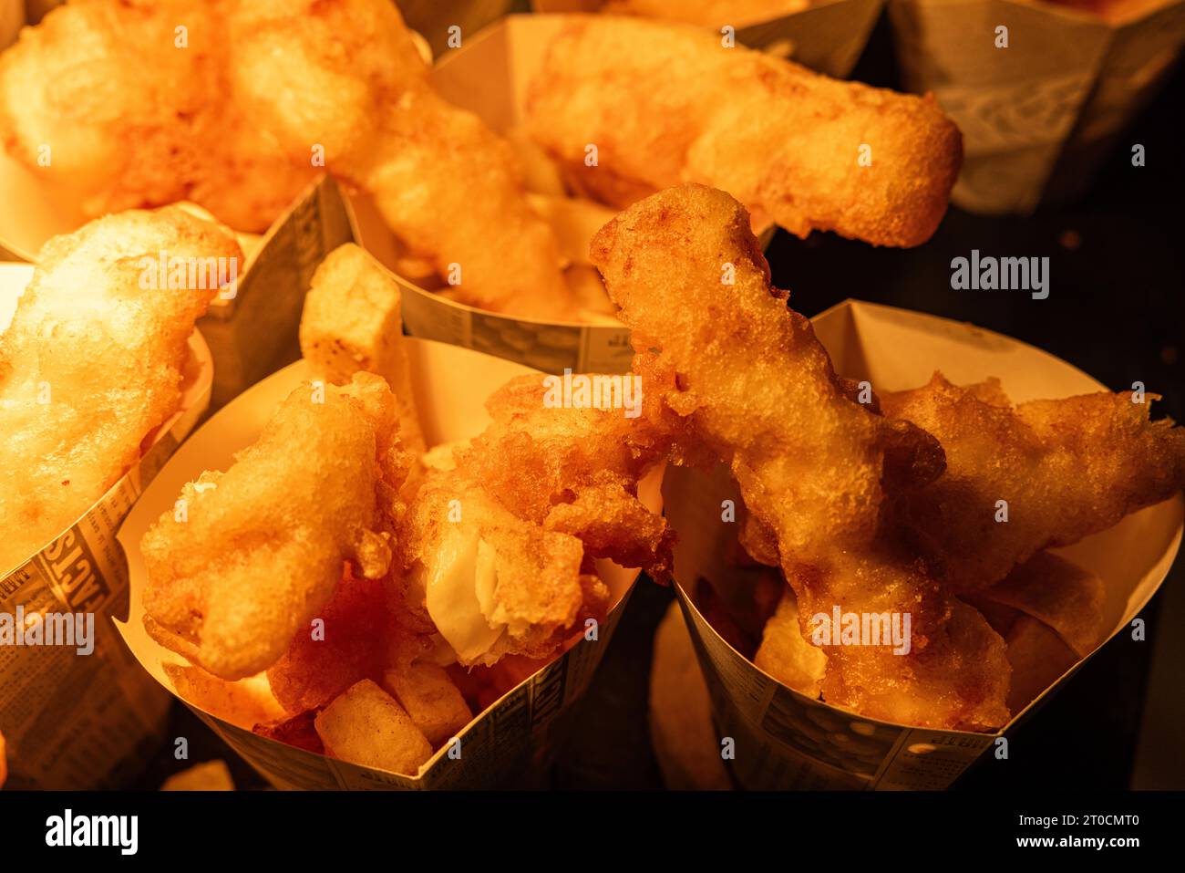 Buffet, finger food fish and chips in paper cones at a party Stock