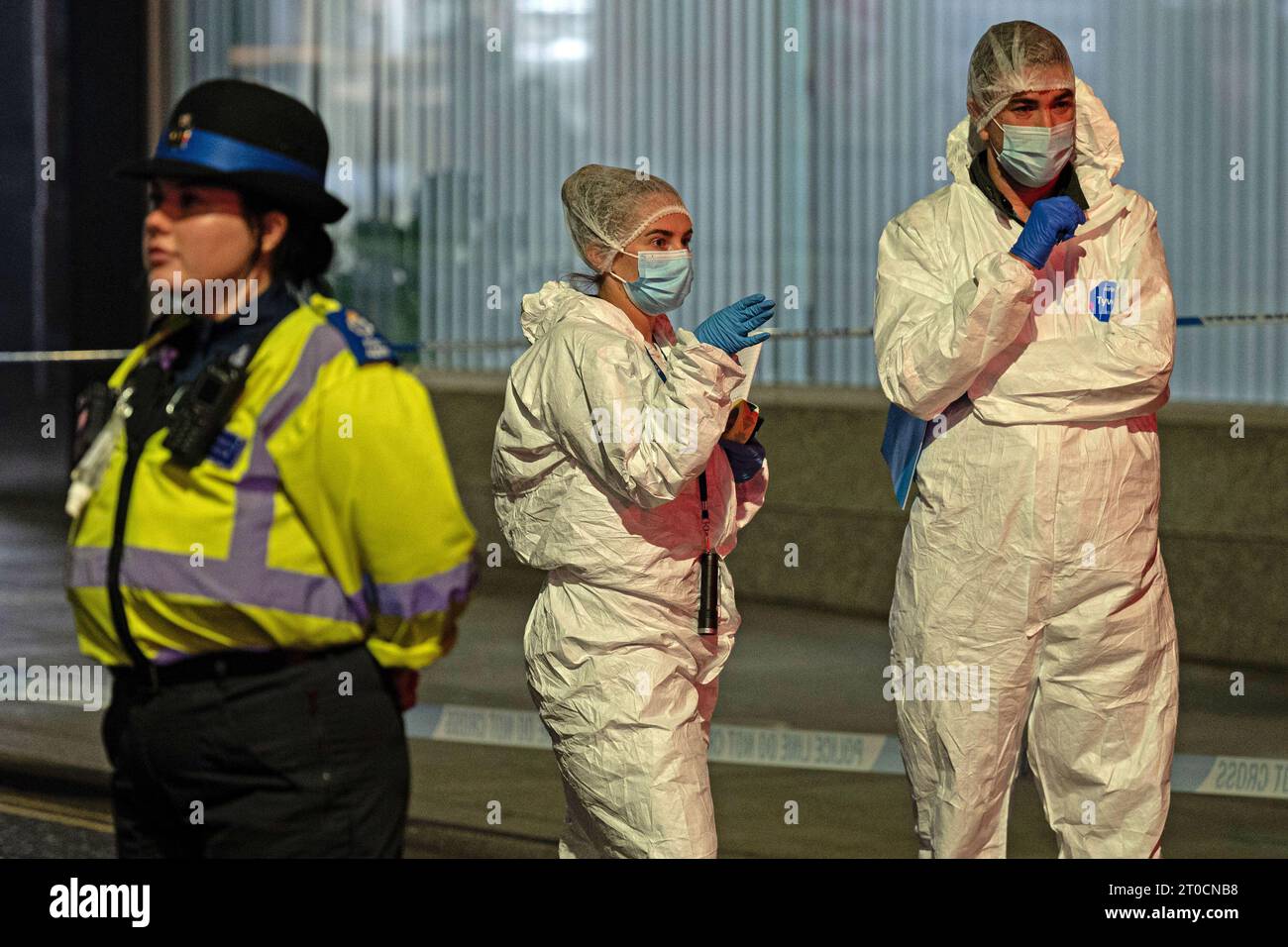 Police and forensic investigators at the scene in Brighton where a 17 ...