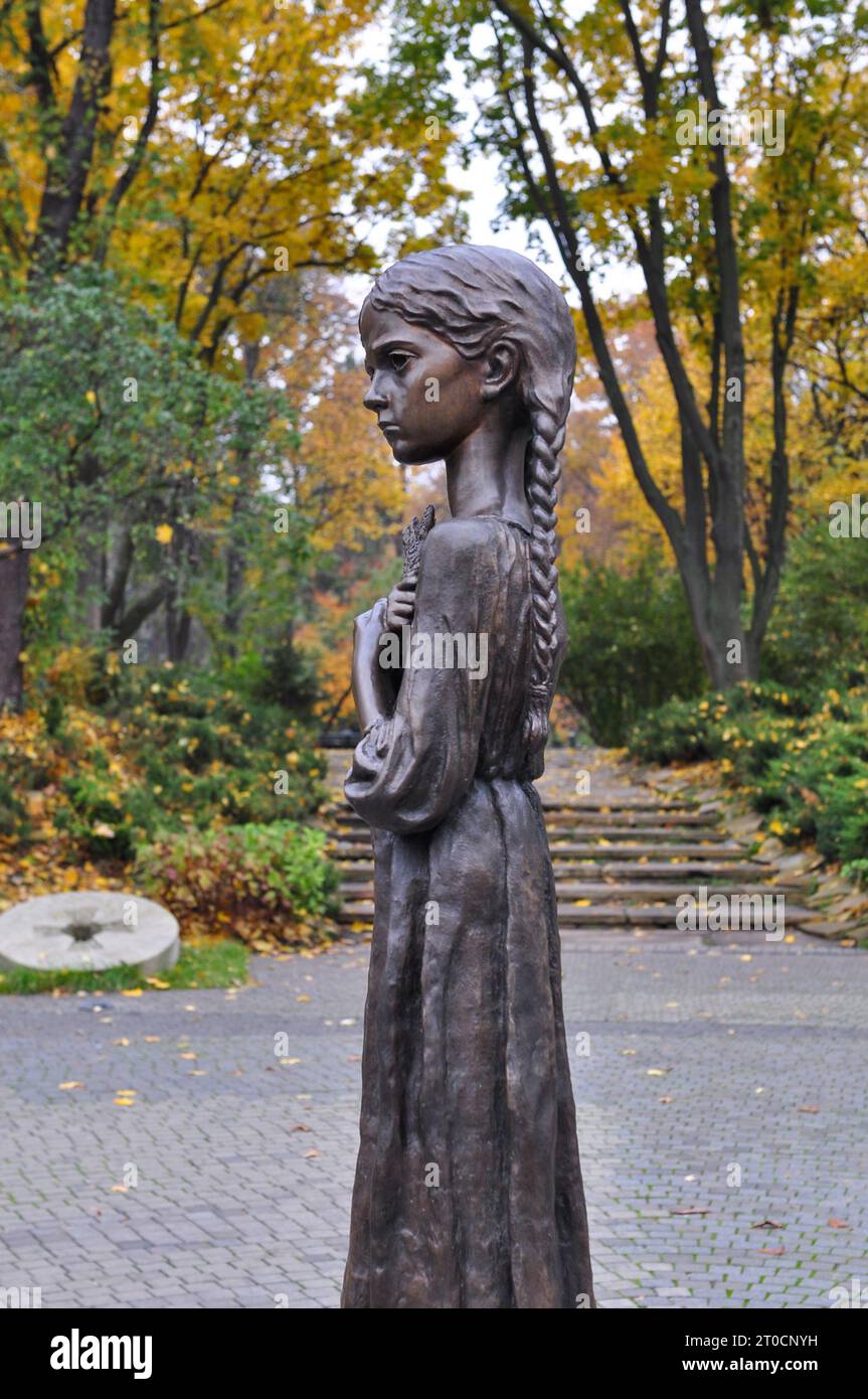 Memorial statue of a girl holding wheat outside the Holodomor Genocide