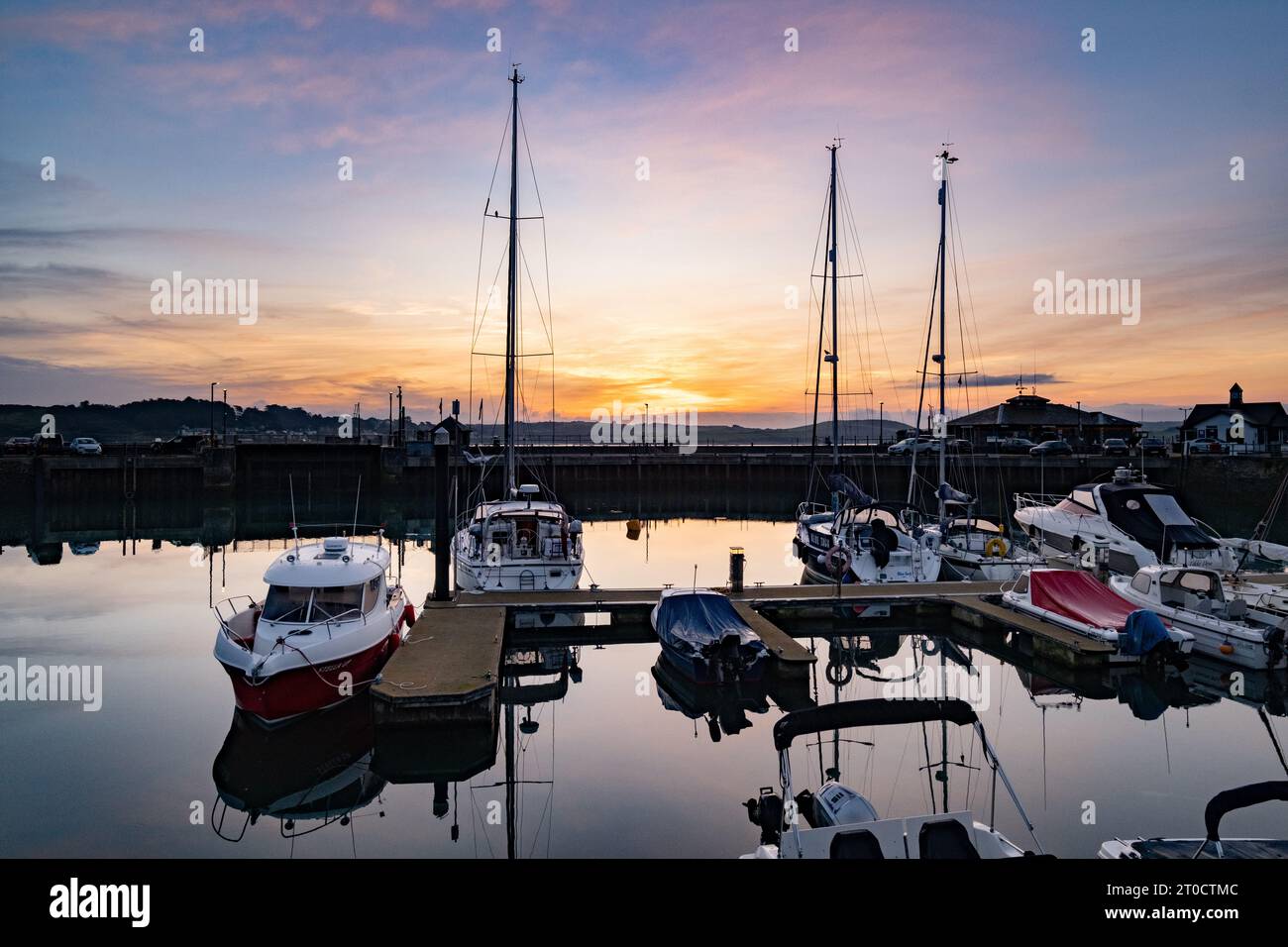 Padstow, Cornwall, UK. 6th October 2023. UK Weather. It was a glorious sunrise at Padstow, overlooking the river camel in Cornwall. The area is expected to see a flurry of visitors over the weekend as hot weather from spain moves in. Credit Simon Maycock / Alamy Live News. Stock Photo