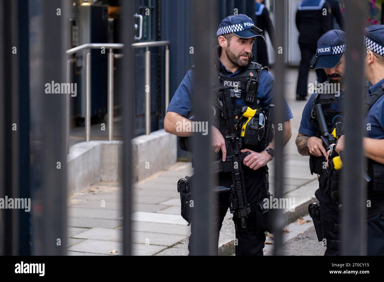 Armed Metropolitan Police on duty inside Downing Street on 25th September 2023 in London, United Kingdom. It was reported today that some 300 officers had handed in their permits allowing them to carry weapons over the weekend following an officer being charged with the murder of Chris Kaba. The Army were briefly put on standby but have been stood down as the Met have reported that enough officers are back to duty. Stock Photo