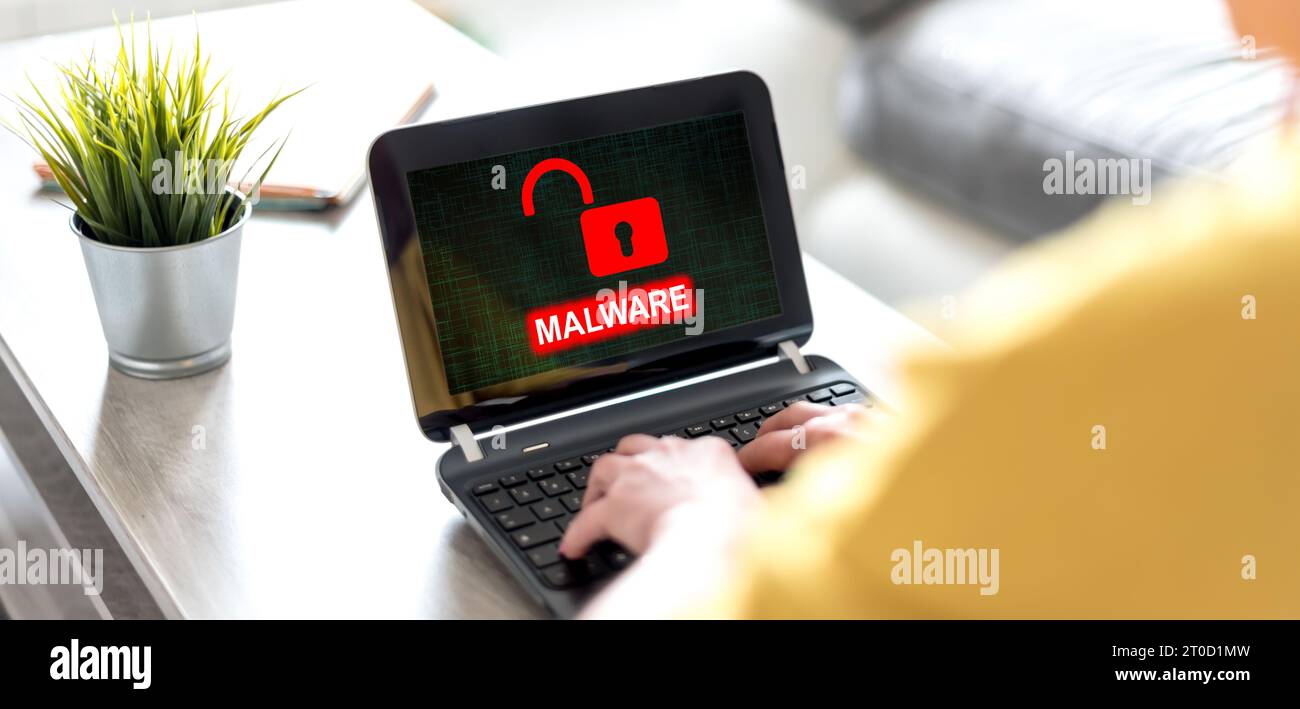 Laptop screen displaying a malware concept Stock Photo - Alamy