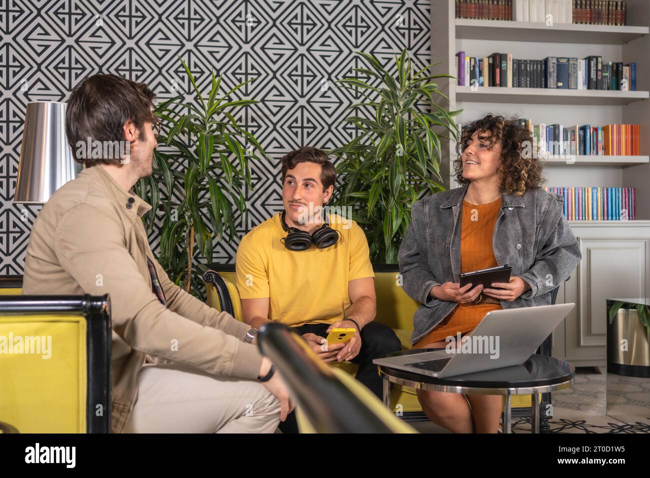 Young business people in informal clothes in a meeting in an hotel Stock Photo