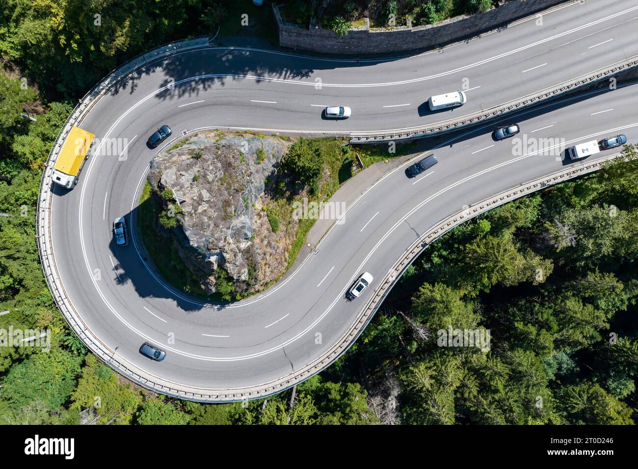 Kreuzfelsenkurve, federal road 31 with cars and trucks, most spectacular curve in the Black Forest, drone photo, Breitnau, Baden-Wuerttemberg, Germany Stock Photo