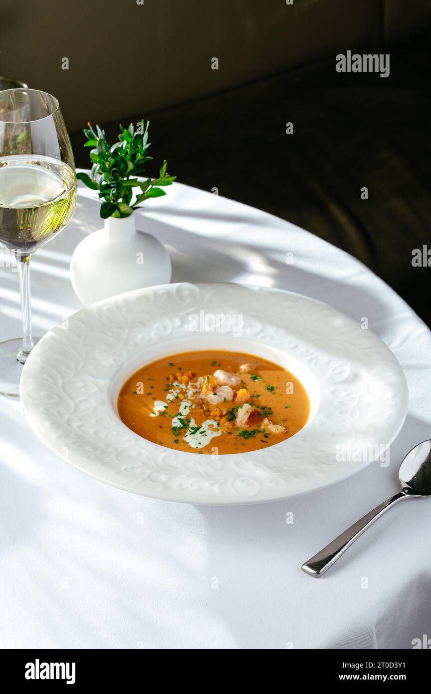 cream soup with tomatoes, shrimp and lentils Stock Photo