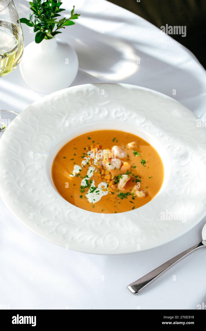 cream soup with tomatoes, shrimp and lentils Stock Photo