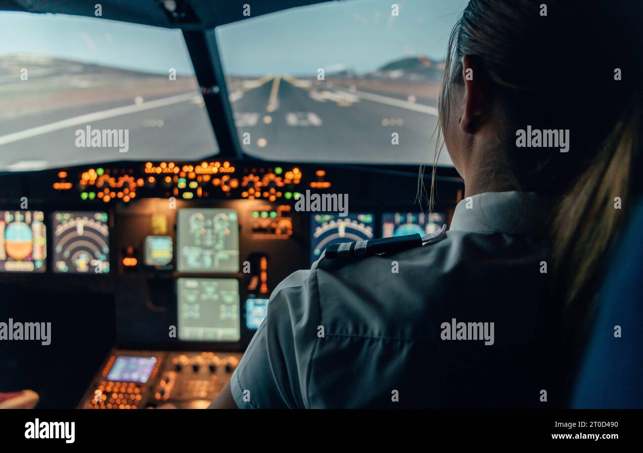 Unrecognizable female pilot on the cockpit of an aircraft Stock Photo