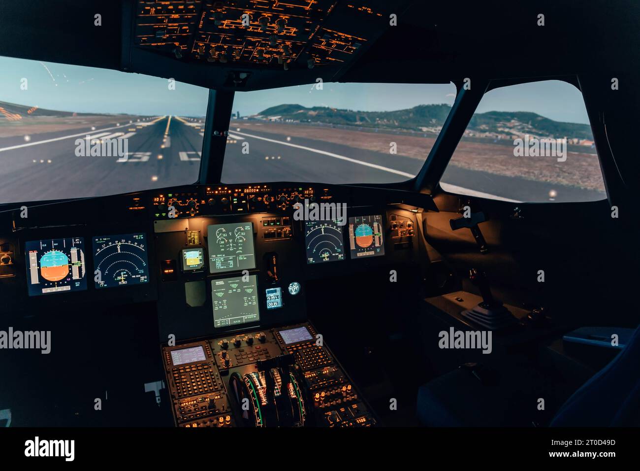 Cockpit of an airliner with the lights on Stock Photo