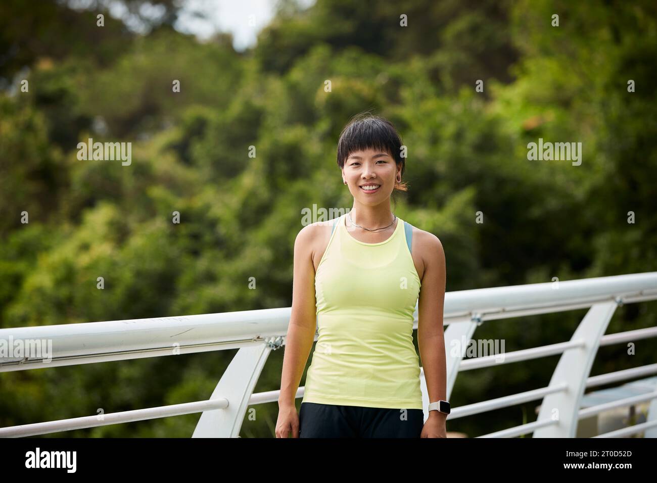 outdoor portrait of a happy young asian woman female athlete Stock ...