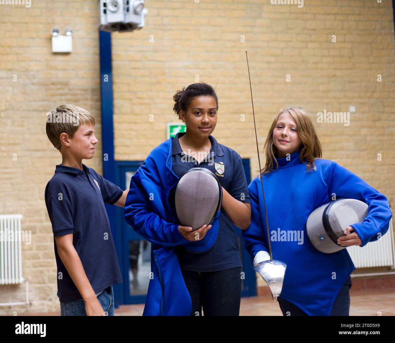 Children fencing at secondary school Stock Photo