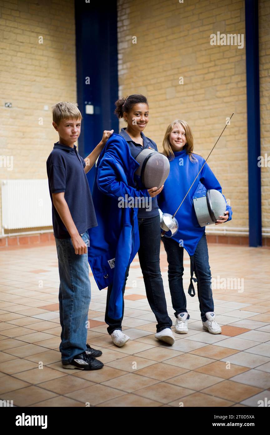 Children fencing at secondary school Stock Photo