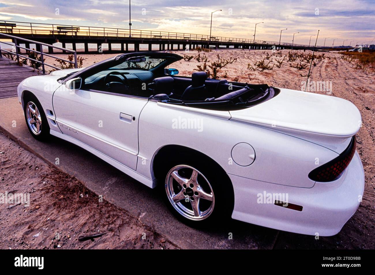 White Pontiac Firebird Trans Am 1999 convertible, series 4 model, parked on wasteland, New York, USA Stock Photo