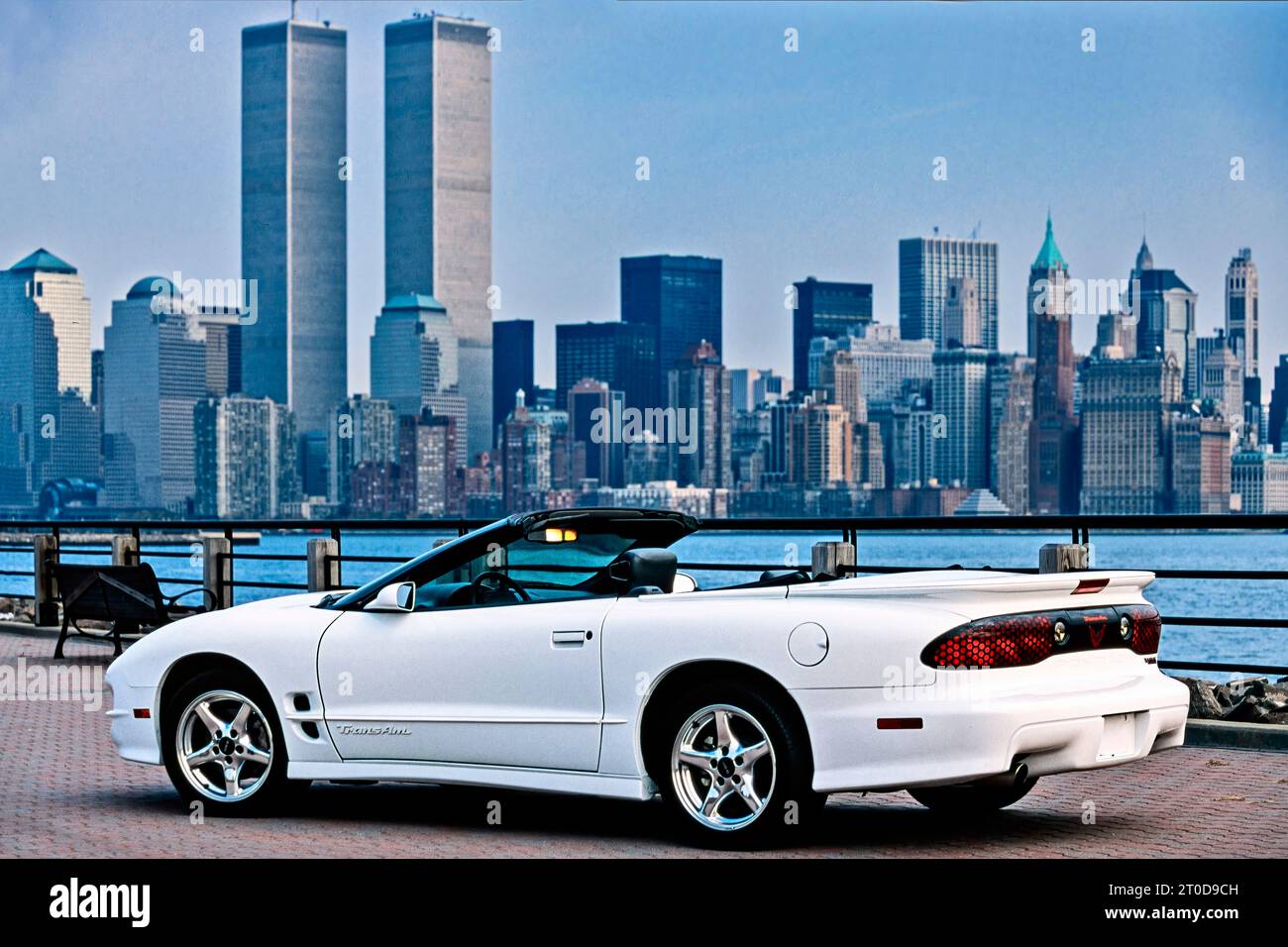 White Pontiac Firebird Trans Am 1999 convertible, series 4 model, parked in front of World Trade Centre skyline, New York, USA Stock Photo