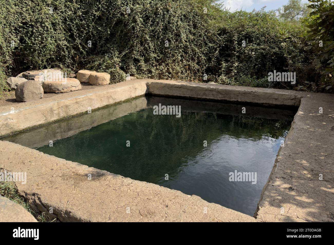 View of a Ein EYH ( named after Israeli soldier Elon Yaakov Horowitz who was killed during his military service) a rectangular spring pool built by Syrian army before 1967 on the southern slopes of the Golan Heights, overlooking the triangle of borders between Israel, Jordan and Syria. east of the Israeli settlement and kibbutz of Metzar. The Syrian Army, before 1967, created Relaxation and Recreation pools at local springs for their officers in several spots on the Golan Heights. All of them are call in Hebrew Breichot Ketzinim (Officers Pools). Stock Photo