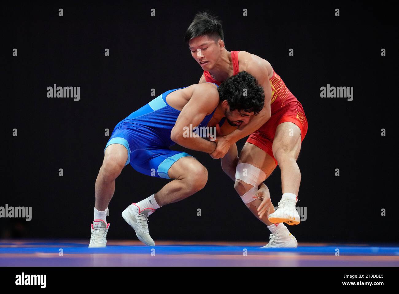 China's Liu Minghu, right, and India's Aman compete during their men's