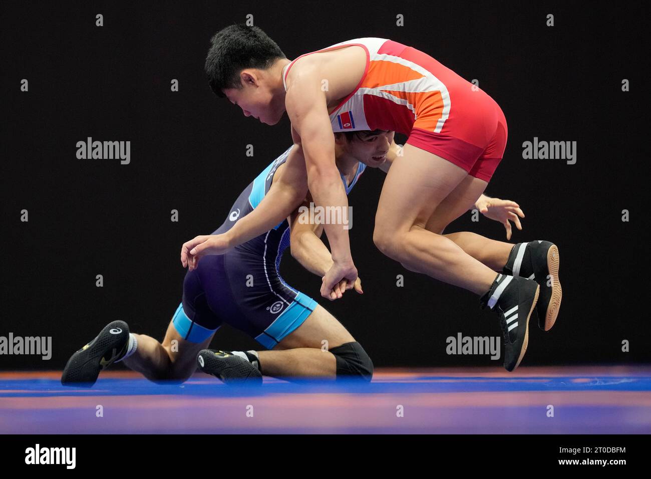 North Korea's Hang Chongsong, right, and Japan's Toshihiro Hasegawa