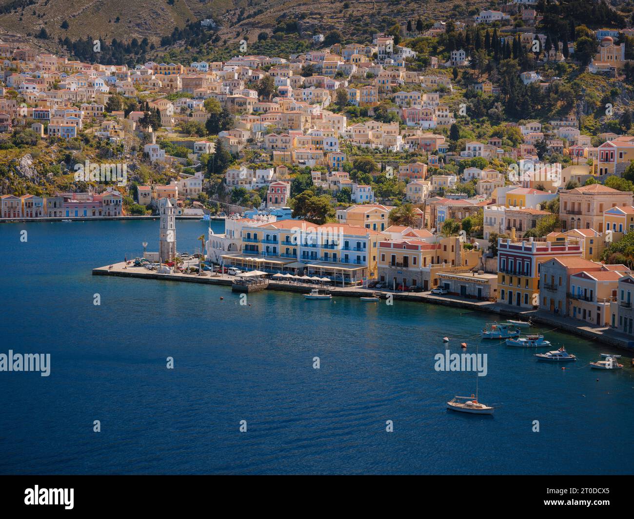 Symi Island, Greece. Greece islands holidays from Rhodos in Aegean Sea. Colorful neoclassical houses in bay of Symi. Holiday travel background. view f Stock Photo