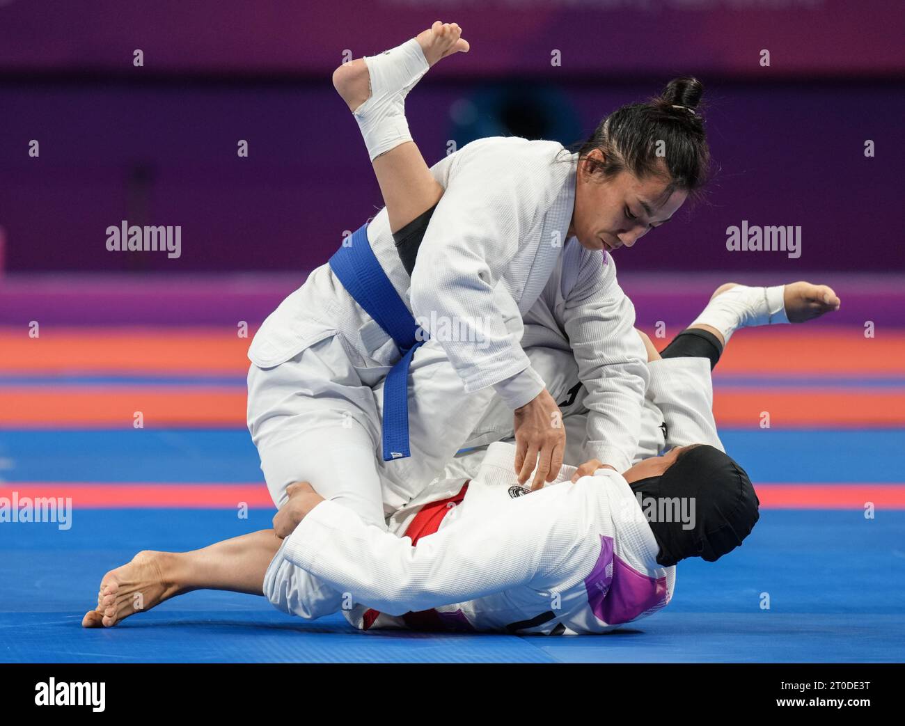 Hangzhou, China's Zhejiang Province. 6th Oct, 2023. Miao Jie (L) of China competes against United Arab Emirates's Asma Alhosani during the Women -52kg Gold Medal Contest of Ju-jitsu at the 19th Asian Games in Hangzhou, east China's Zhejiang Province, Oct. 6, 2023. Credit: Jiang Wenyao/Xinhua/Alamy Live News Stock Photo