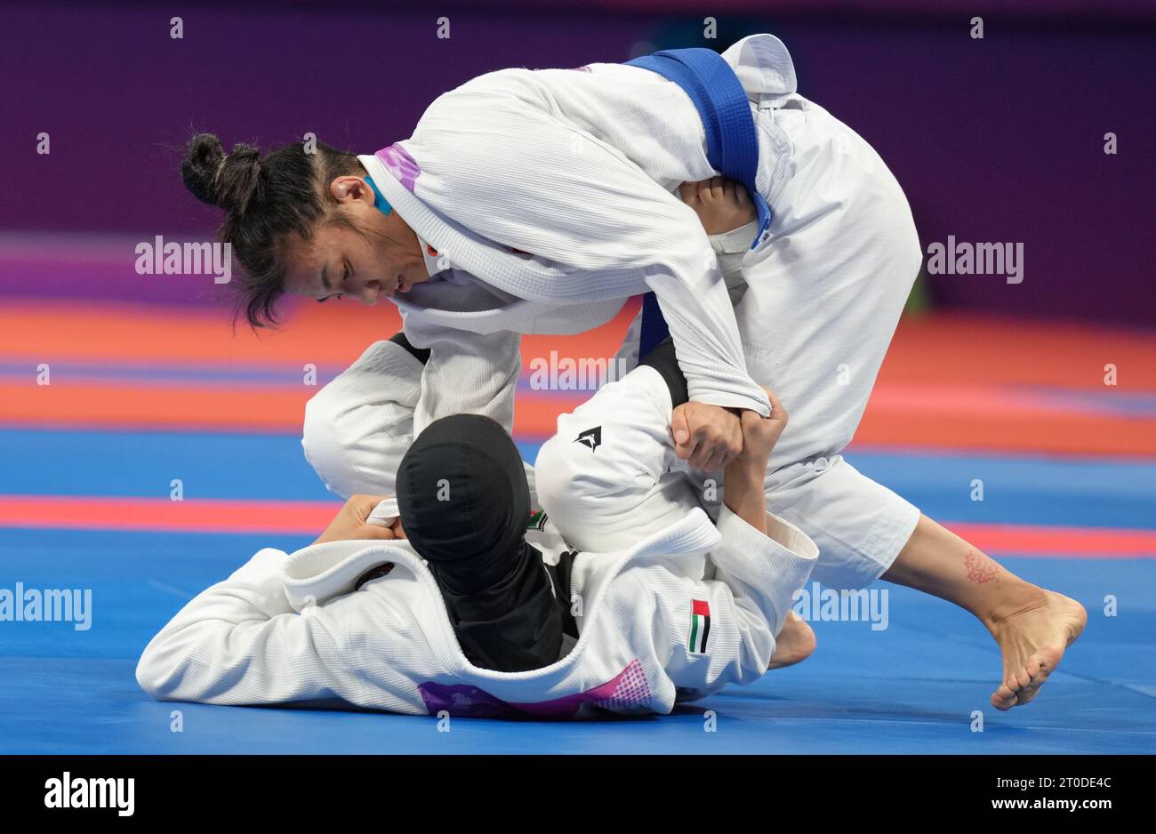 Hangzhou, China's Zhejiang Province. 6th Oct, 2023. Miao Jie (up) of China competes against United Arab Emirates's Asma Alhosani during the Women -52kg Gold Medal Contest of Ju-jitsu at the 19th Asian Games in Hangzhou, east China's Zhejiang Province, Oct. 6, 2023. Credit: Jiang Wenyao/Xinhua/Alamy Live News Stock Photo