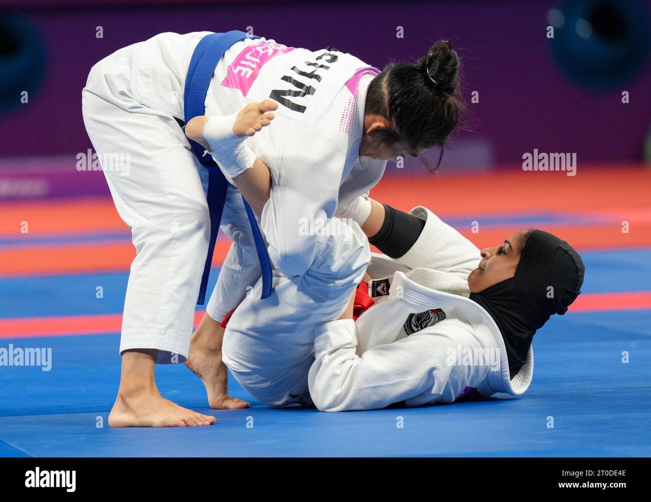 Hangzhou, China's Zhejiang Province. 6th Oct, 2023. Miao Jie (L) of China competes against United Arab Emirates's Asma Alhosani during the Women -52kg Gold Medal Contest of Ju-jitsu at the 19th Asian Games in Hangzhou, east China's Zhejiang Province, Oct. 6, 2023. Credit: Jiang Wenyao/Xinhua/Alamy Live News Stock Photo