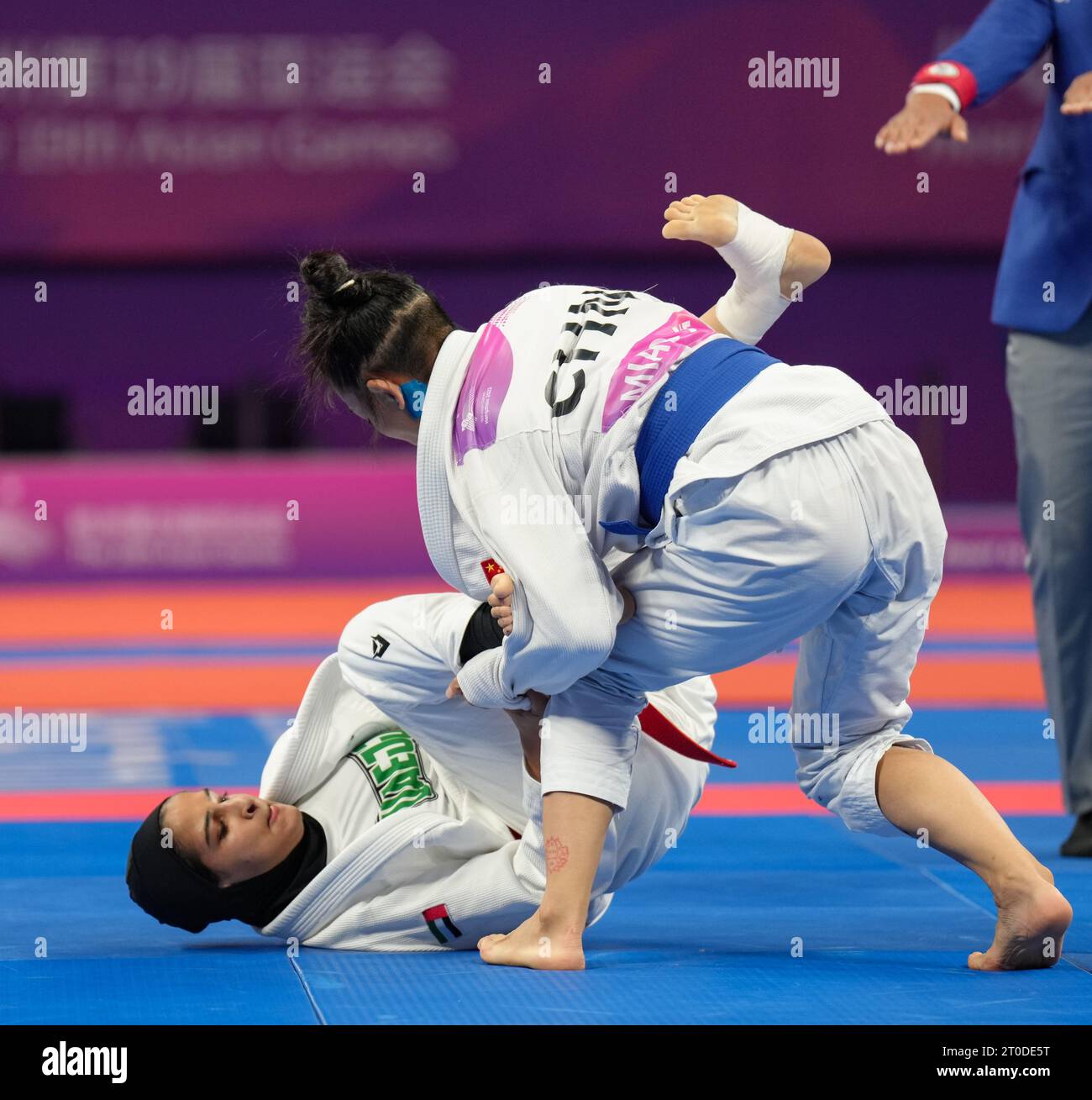 Hangzhou, China's Zhejiang Province. 6th Oct, 2023. Miao Jie (up) of China competes against United Arab Emirates's Asma Alhosani during the Women -52kg Gold Medal Contest of Ju-jitsu at the 19th Asian Games in Hangzhou, east China's Zhejiang Province, Oct. 6, 2023. Credit: Jiang Wenyao/Xinhua/Alamy Live News Stock Photo