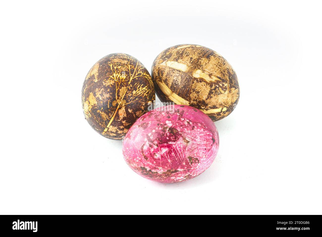 Three artistically painted easter eggs isolated on white. Stock Photo