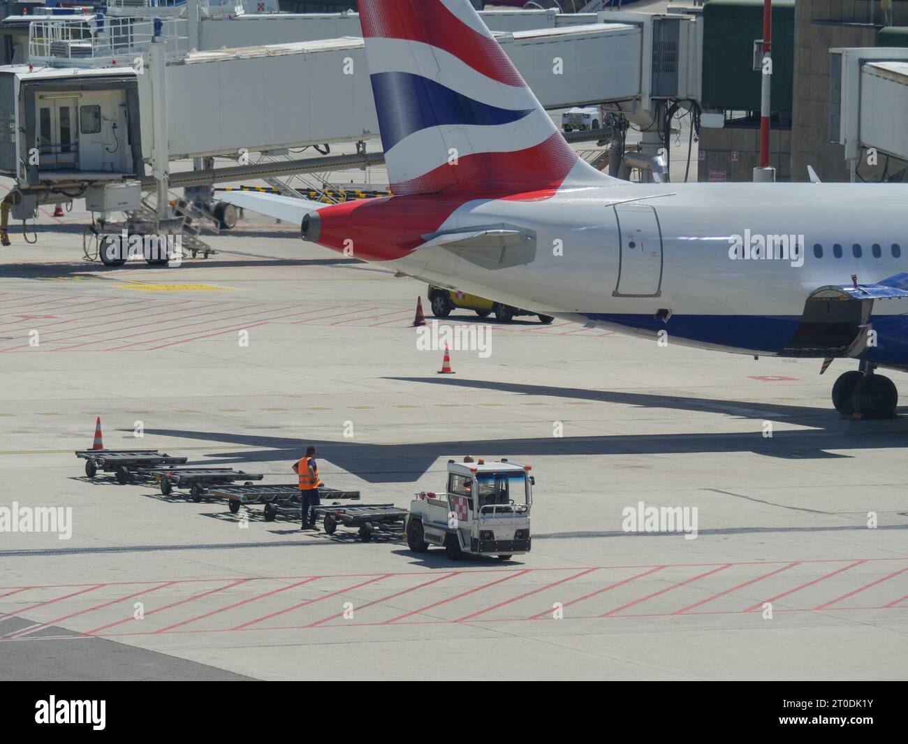 Small Motorized Vehicle with No Cargo on board because the material to be transported has already been Boarded on the Aircraft. Stock Photo