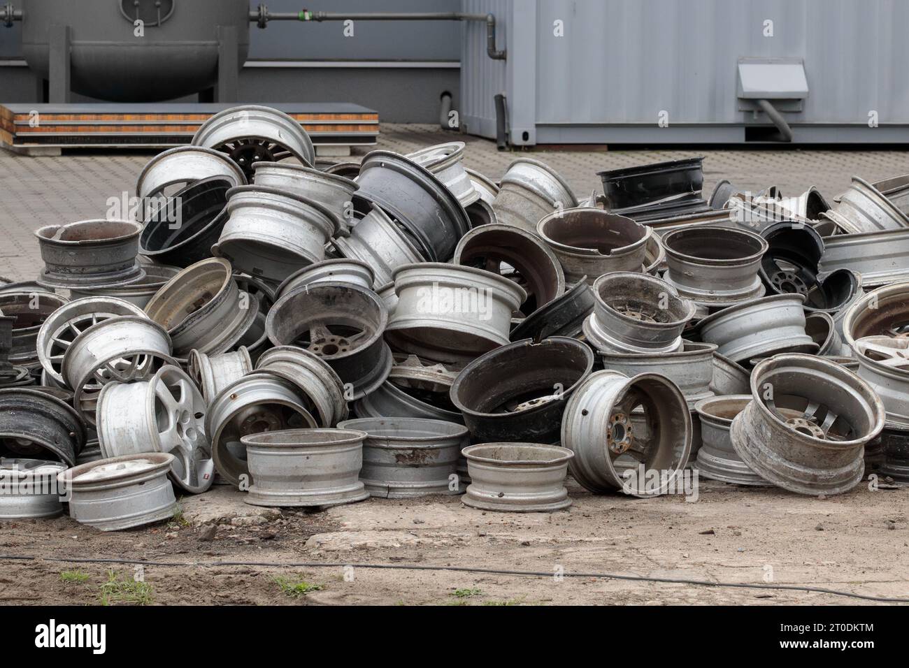 Old Car Rims Pile at Scrapheap Junkyard. Stack of old discarded wheels