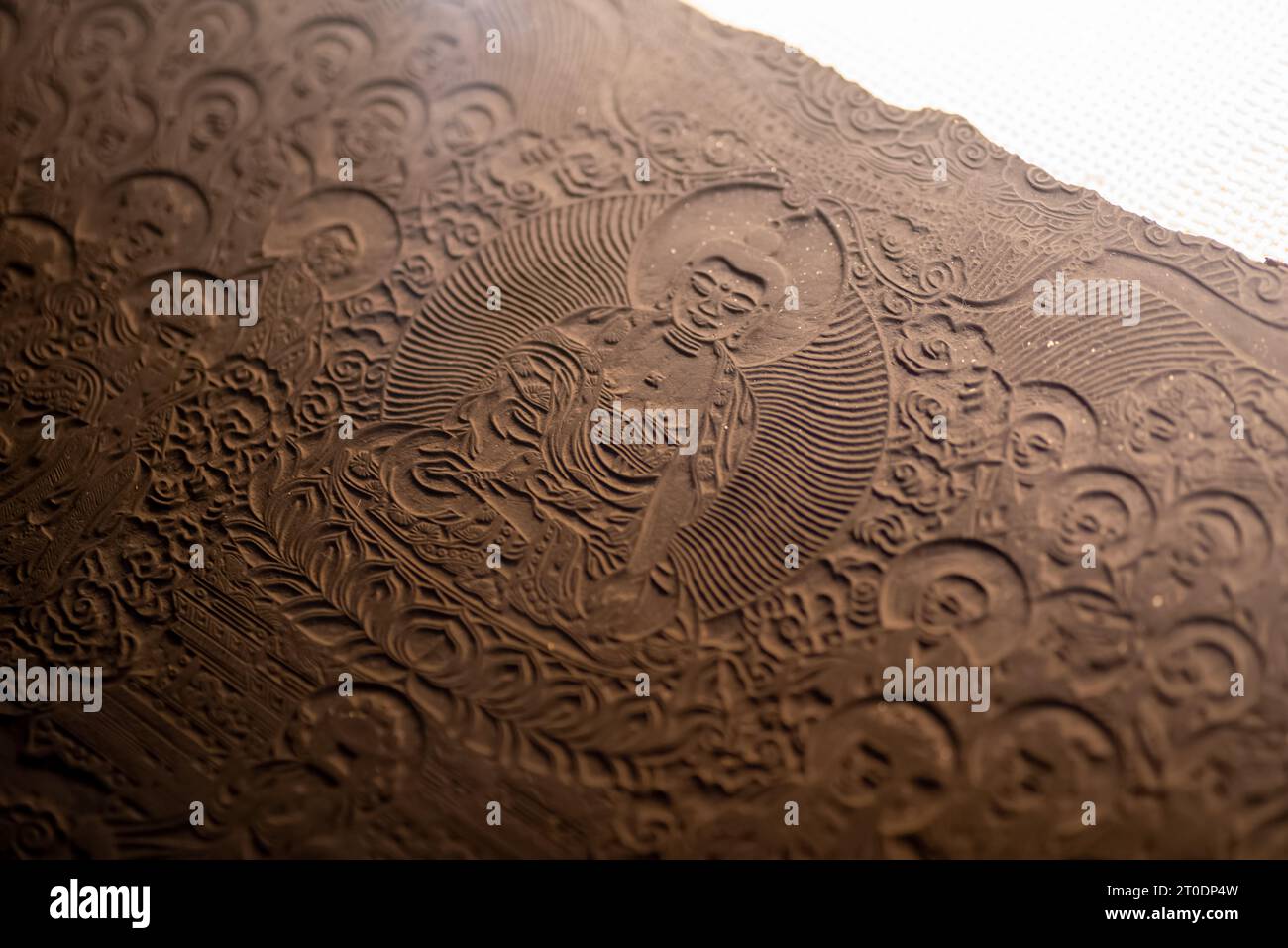 Ancient Chinese woodblock printing board, ancestor of printing press technique from China,shot at China engraving printing museum. Stock Photo