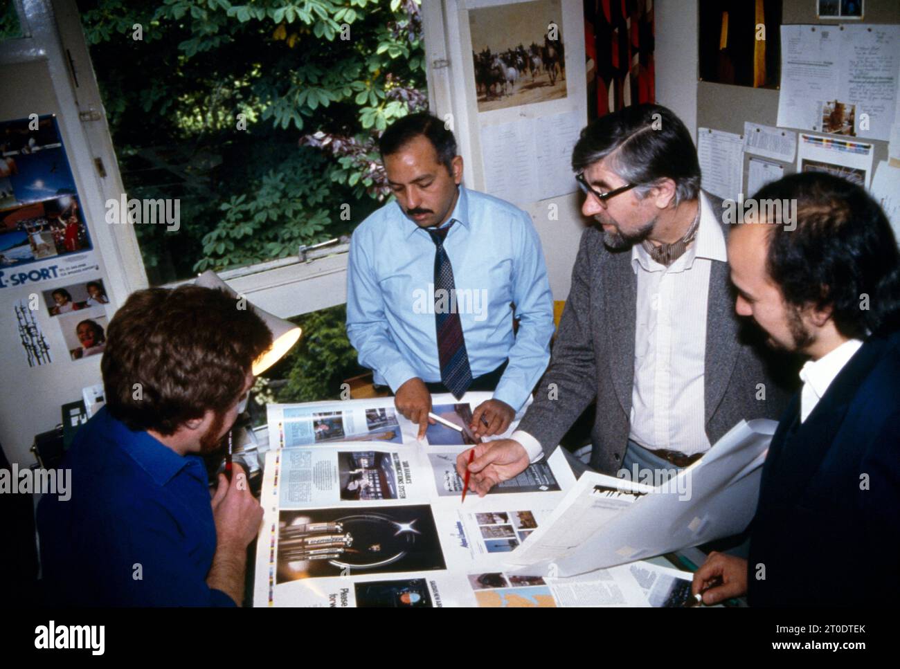 Proofing Layouts Magazine Multi Ethnic Office Stock Photo