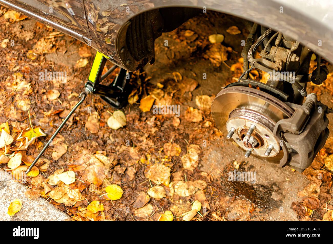 changing the tires of a car from summer tires to winter tires in autumn