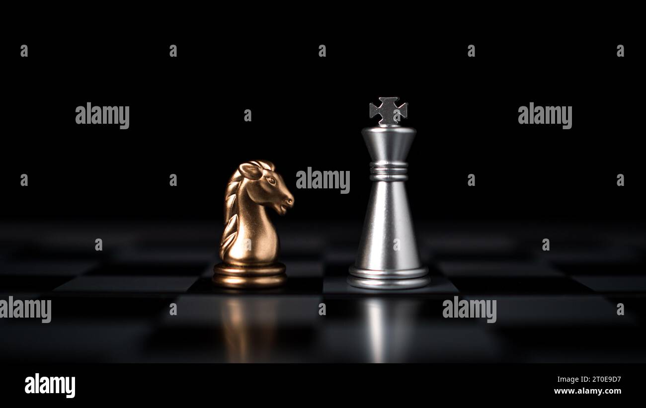 Gold and silver chess pieces in chess board game for business ...