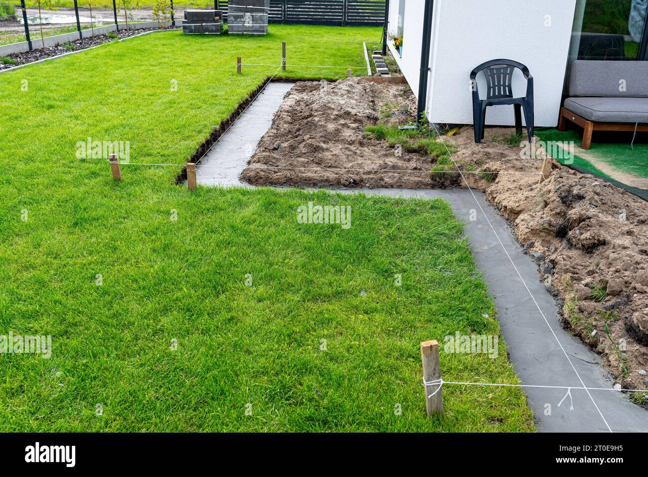 Foundation footings poured in a ditch in the yard, building a terrace in the backyard Stock