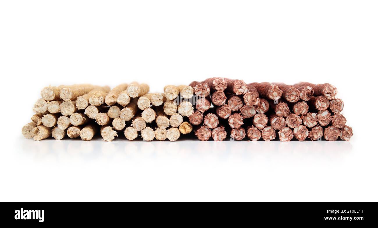 Many rawhide chew sticks for dogs, front view. Large amount of chicken