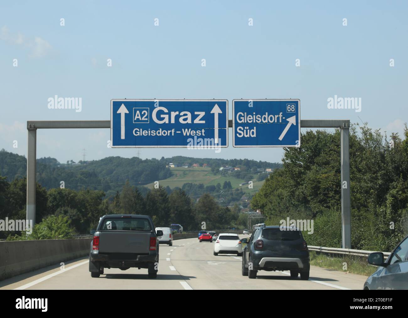 road sign on the highway with Austrian locations and arrows to reach them Stock Photo