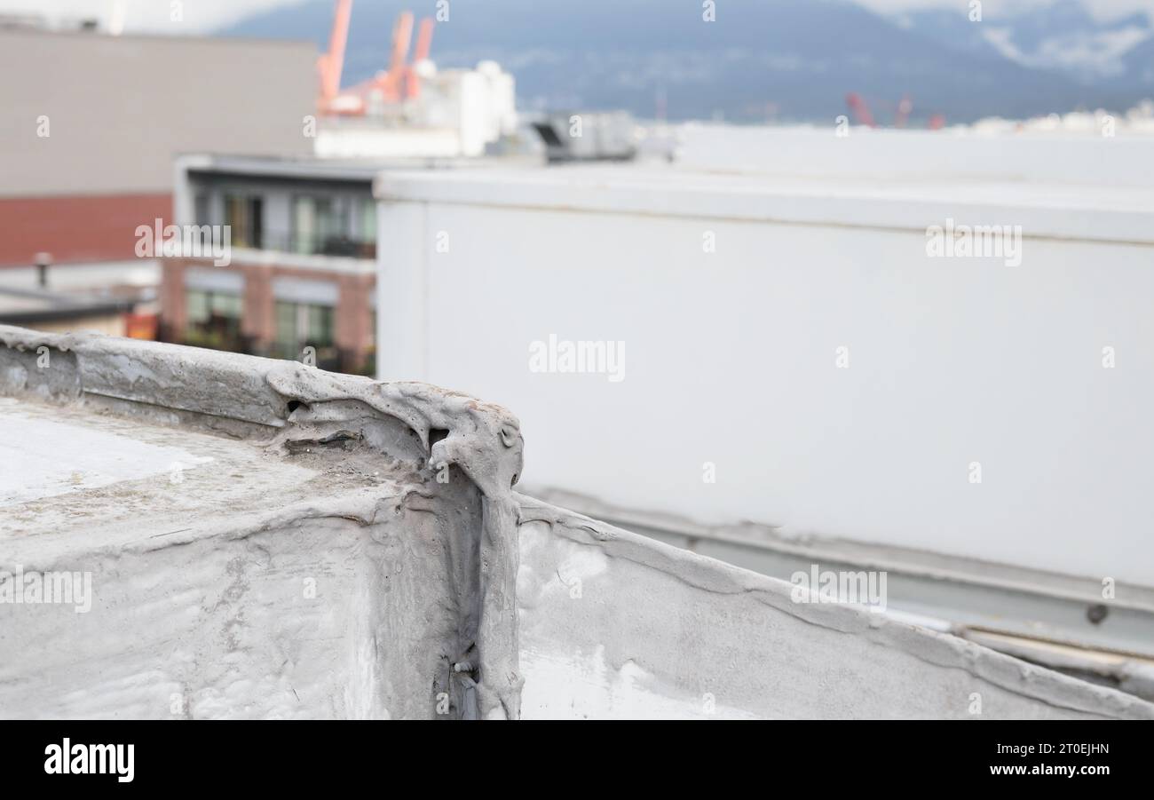 Corner seam of hvac unit with waterproofing repair on flat roof Rooftop