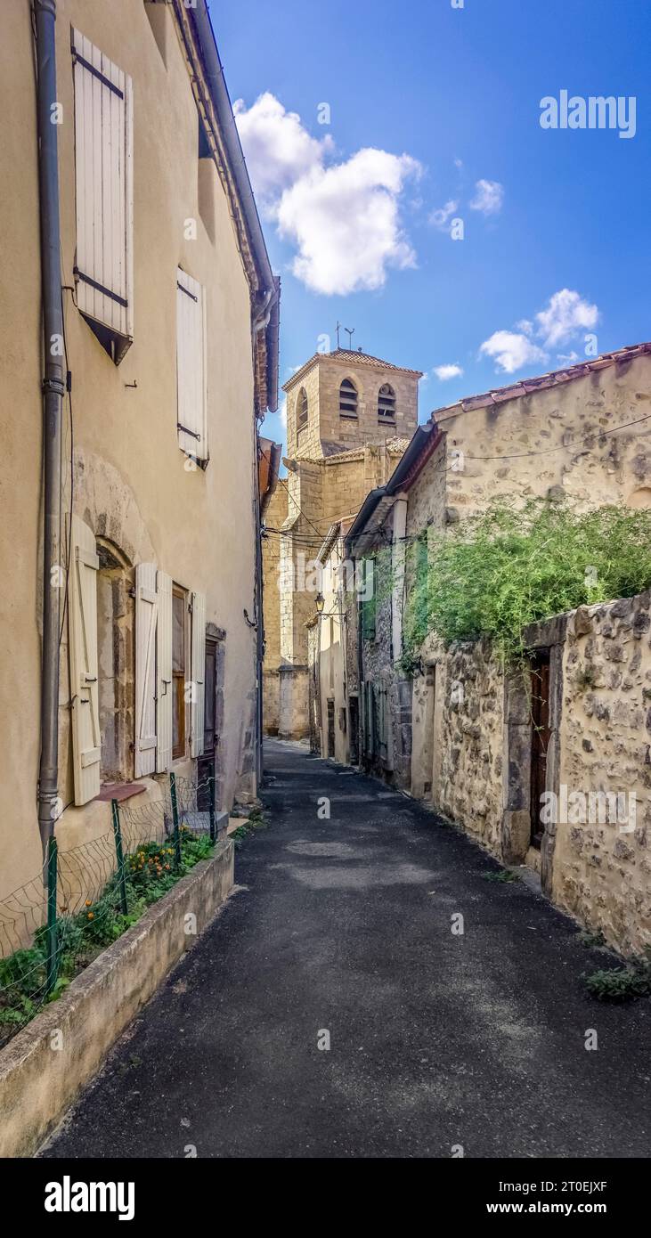Alley and steeple of the parish church of Saint Michel in Lagrasse. Built in the XIV century in Gothic style. Monument historique. Plus beaux villages de France. Stock Photo