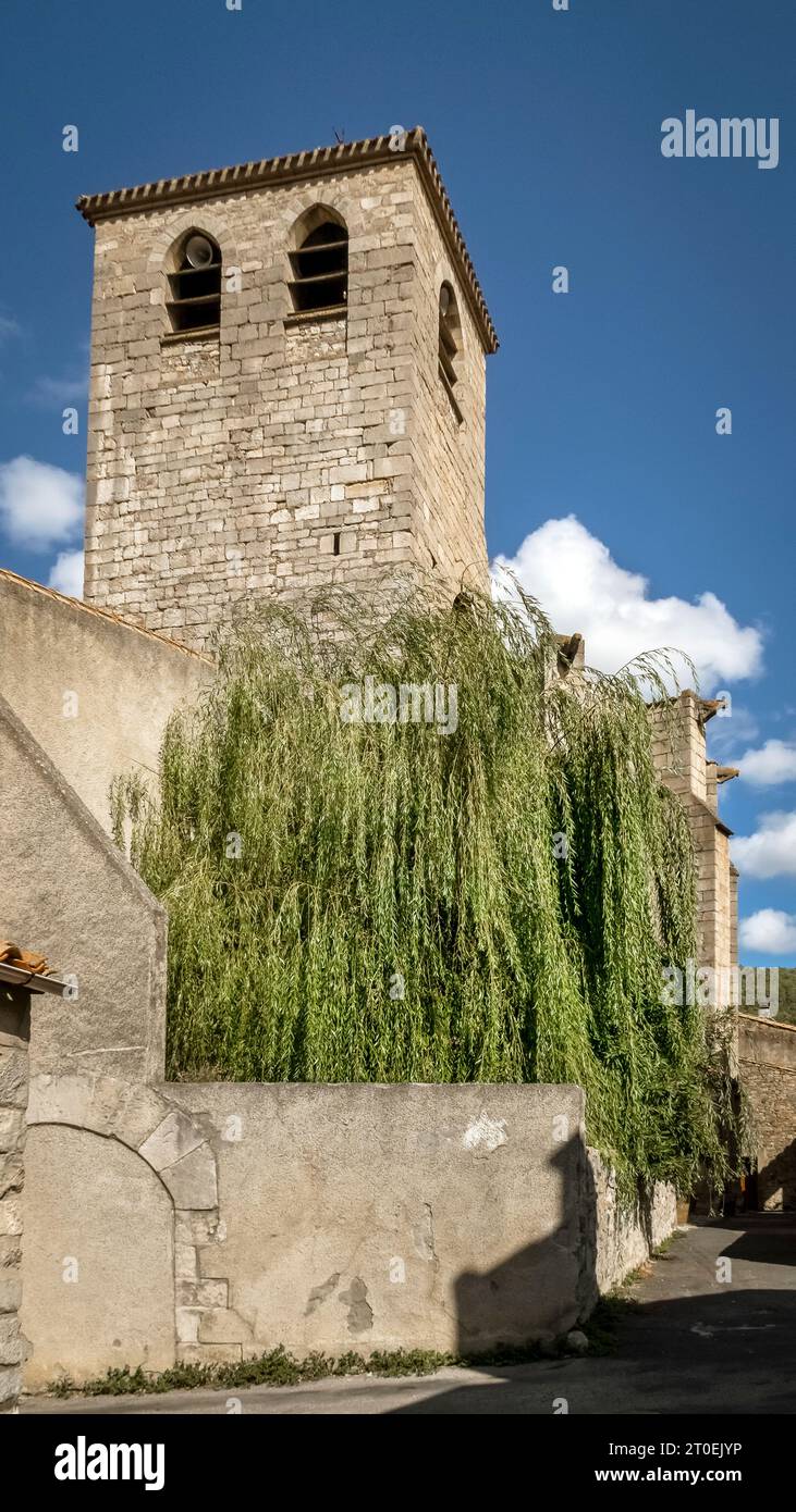 Tower of the parish church of Saint Michel in Lagrasse. Built in the XIV century in Gothic style. Monument historique. Plus beaux villages de France. Stock Photo
