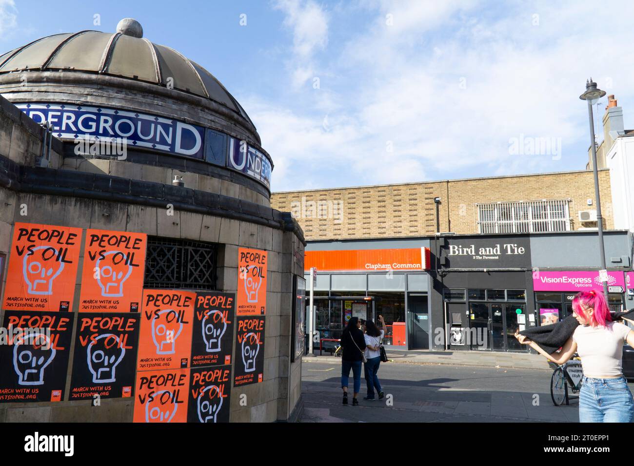 London, UK. 6th Oct, 2023. bright orange and black posters with the slogan 'People vs oil' have been plastered on the exterior of Clapham Common tube station by environmental campaign group Just Stop Oil. The group are planning a series of peaceful protests from 29 October onwards. Credit: Anna Watson/Alamy Live News Stock Photo